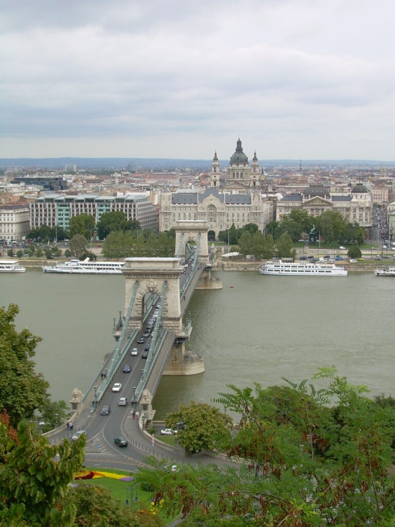 An elevated view of the Chain Bridge spanning a river in Budapest 