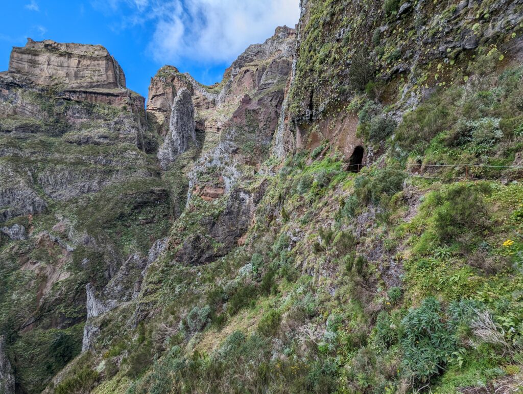 A mountain landscape with a tunnel opening