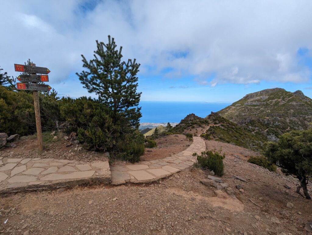 A stone path leading towards rolling hills